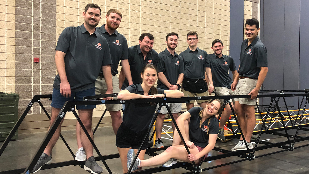 Members of the Auburn University student chapter of the American Society of Civil Engineers pose while competing in the organization's annual steel bridge competition.