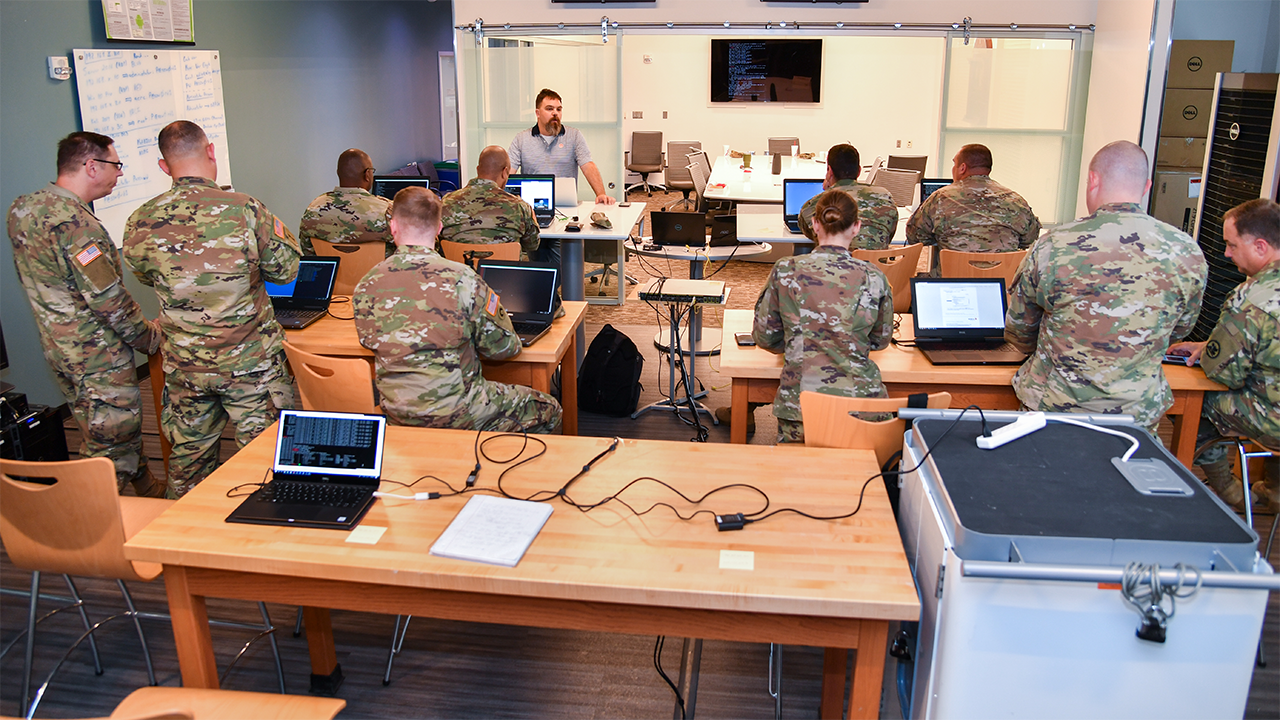 Jason Cuneo leads a session with Alabama National Guard members. 