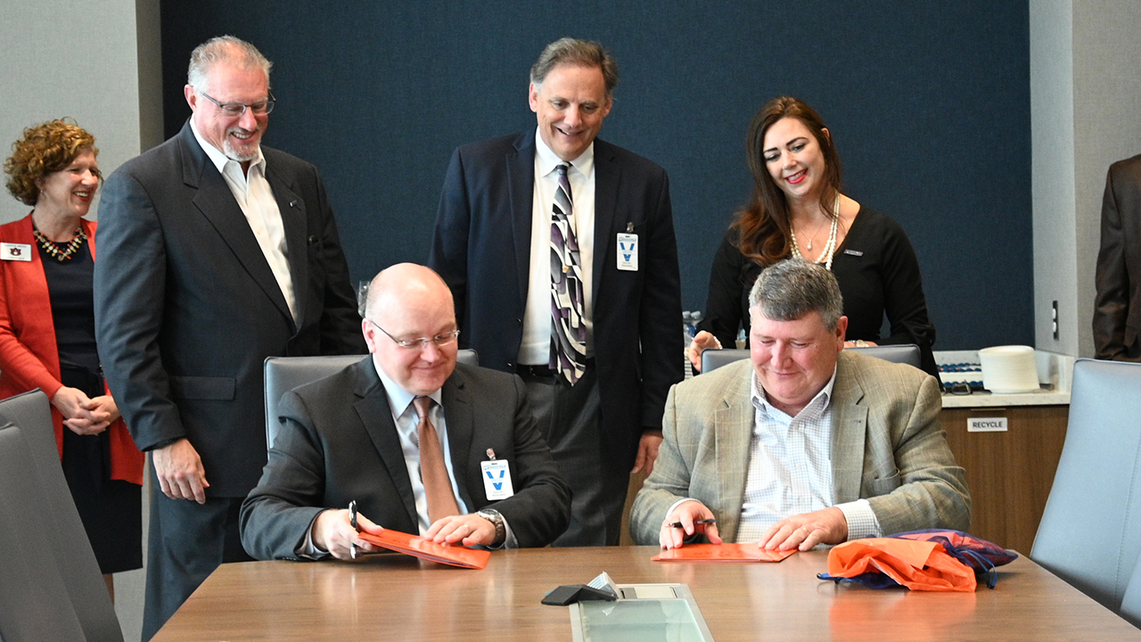 Auburn Engineering Dean Christopher B. Roberts (seated left) and Radiance Technologies CEO Bill Bailey (seated right) signed a Memorandum of Agreement with Radiance, based in Huntsville, in January 2020 to offer a fully online Master of Engineering Management (MEM) Cohort Program to full-time Radiance employees.