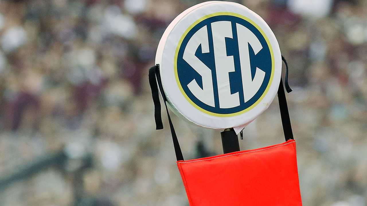 The SEC logo is pictured on a football down marker.