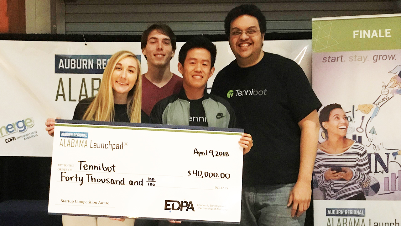 The Tennibot team is shown with a $40,000 prize from Alabama Launchpad.