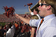 Student waving shaker.