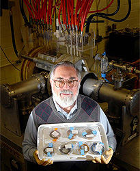 Roy Broughton with seven polymer samples