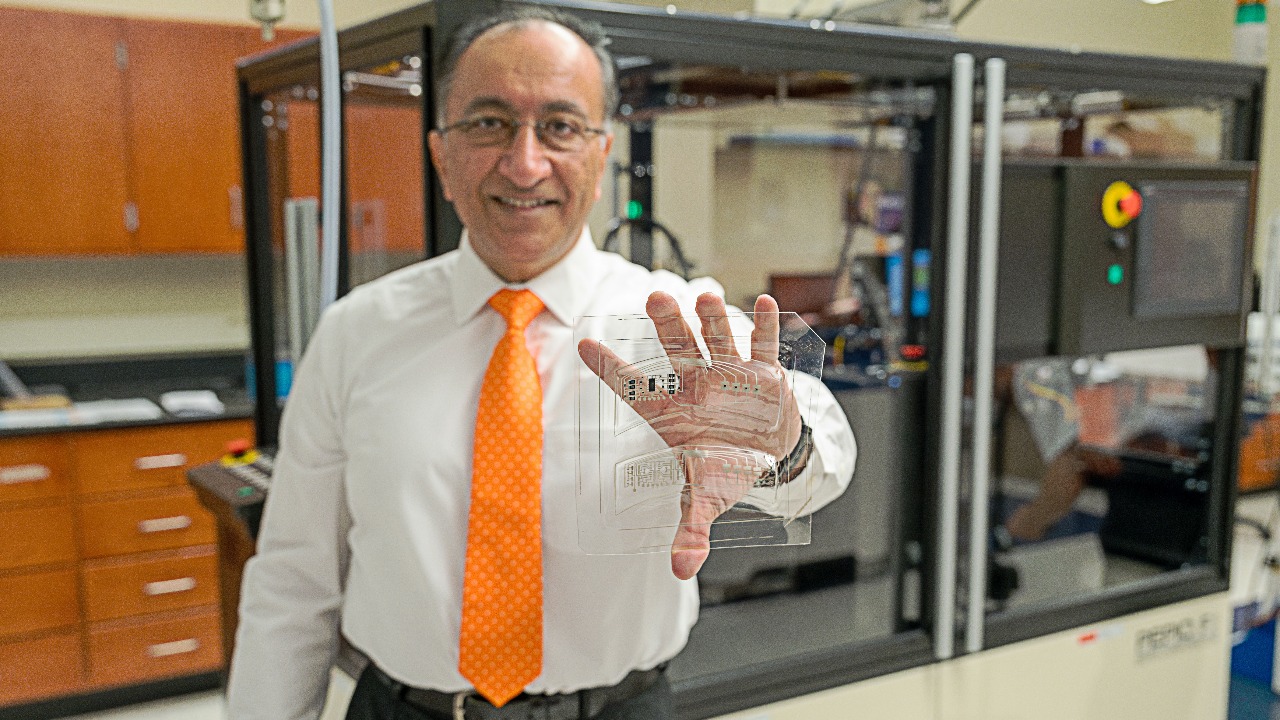 Pradeep Lall, the MacFarlane Endowed Distinguished Professor and Alumni Professor of mechanical engineering, displays an in-mold galvanic skin response sensor for automotive applications additively manufactured at the Auburn University Electronics Packaging Research Institute.