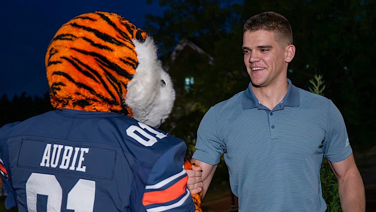 Ben Timm greets Aubie after being selected 'Mic-man' for the 2024-25 school year.