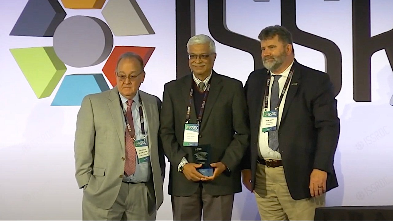 Mechanical engineering professor emeritus Sushil Bhavnani (center) receives the the prestigious International Space Station National Lab 2024 Compelling Results Award at this year's International Space Station Research and Development Conference in Boston. 