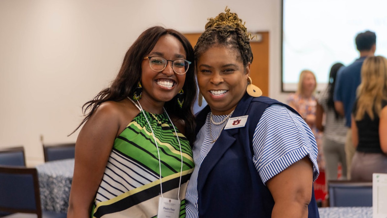 Industrial and systems engineering junior Phedra Peter (left) and Shannon Young, Center for Inspiring Engineering Excellence (CI2E) program coordinator, pose at a center networking event in 2023.