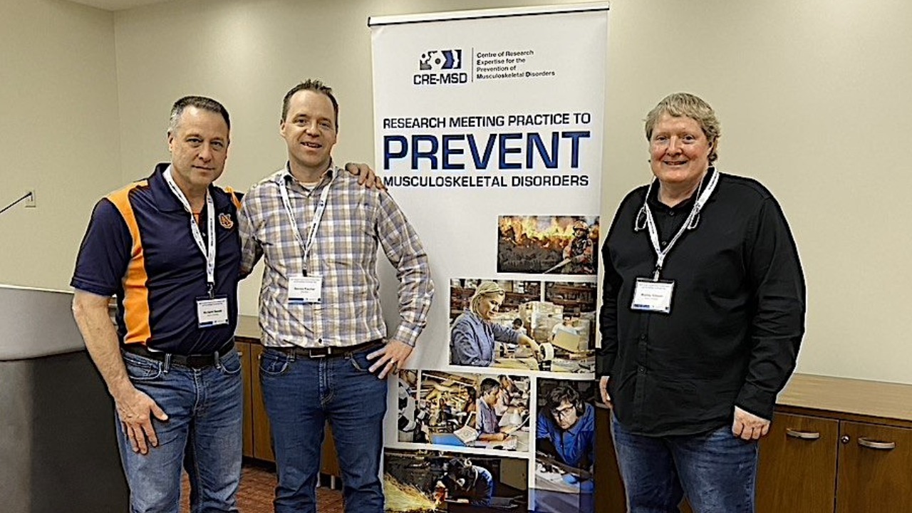 Richard Sesek (l) and Murray Gibson (r) pose at the System Ergonomics Collaboration and Knowledge Exchange Day hosted by the Centre of Research Expertise for the Prevention of Musculoskeletal Disorders in Ontario, Canada. 