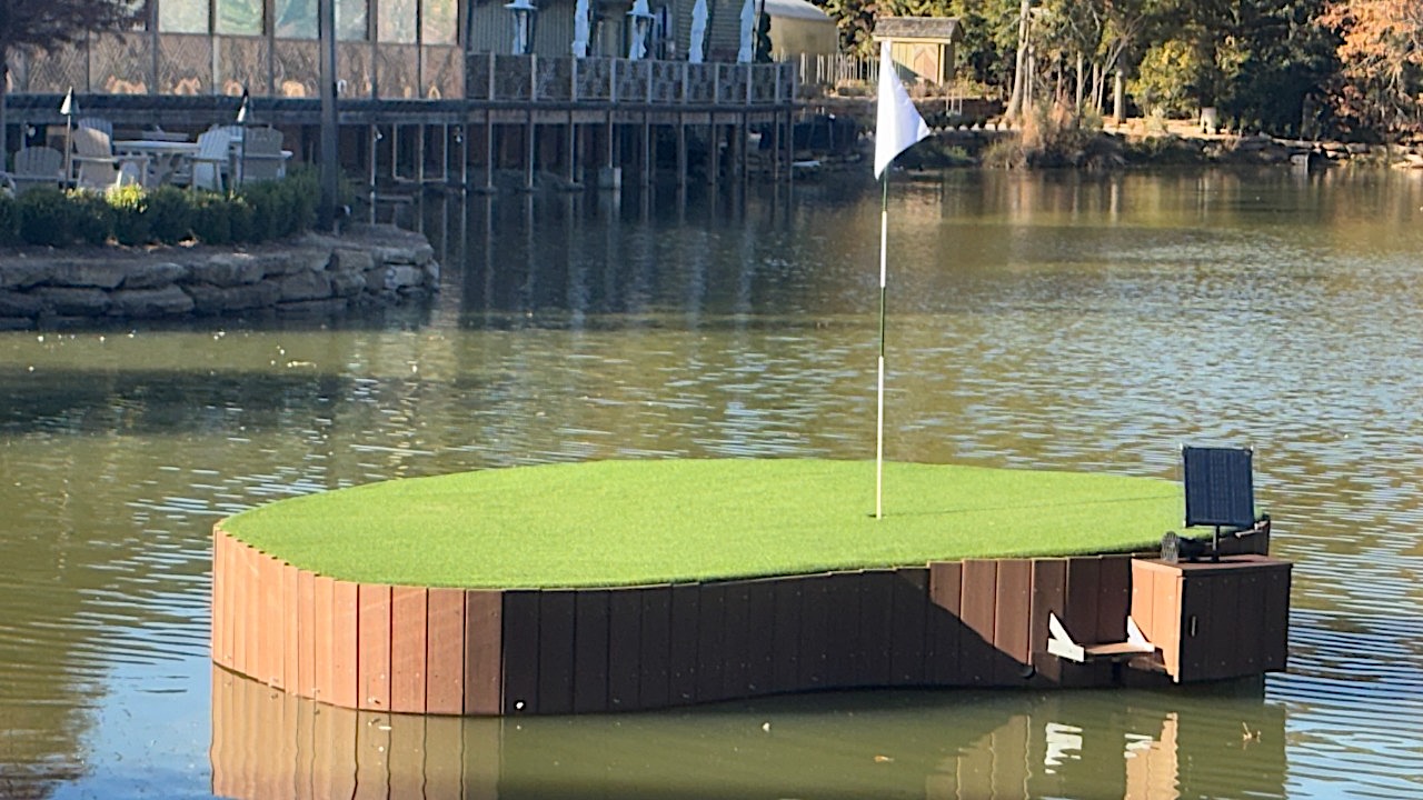 The custom-built floating chipping green at Botanic in Opelika was designed and built by Auburn engineering faculty and students. Modeled after the 8th hole of the Auburn University Club, the solar-powered installation features waterproof sensors and electronics that play the "War Eagle" fight song for every hole-in-one.