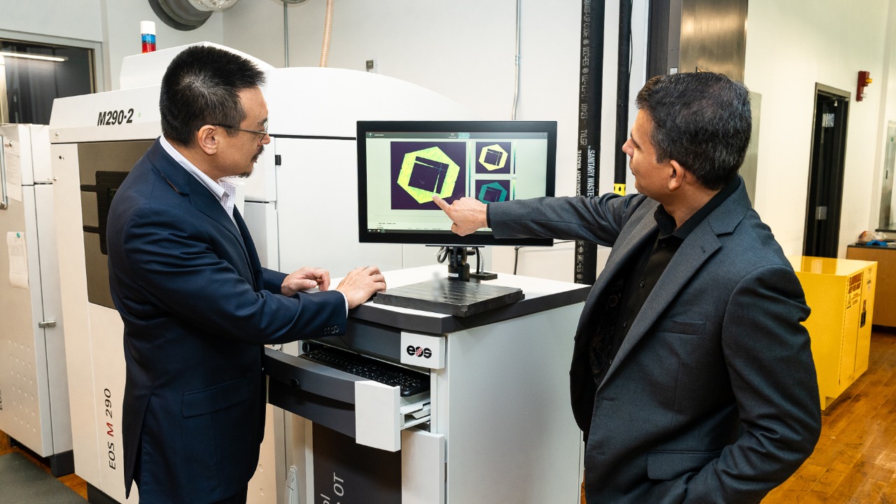 Shuai Shao (left) and Nima Shamsaei review in-situ monitoring data collected from the laser powder-bed fusion fabrication of metallic parts.