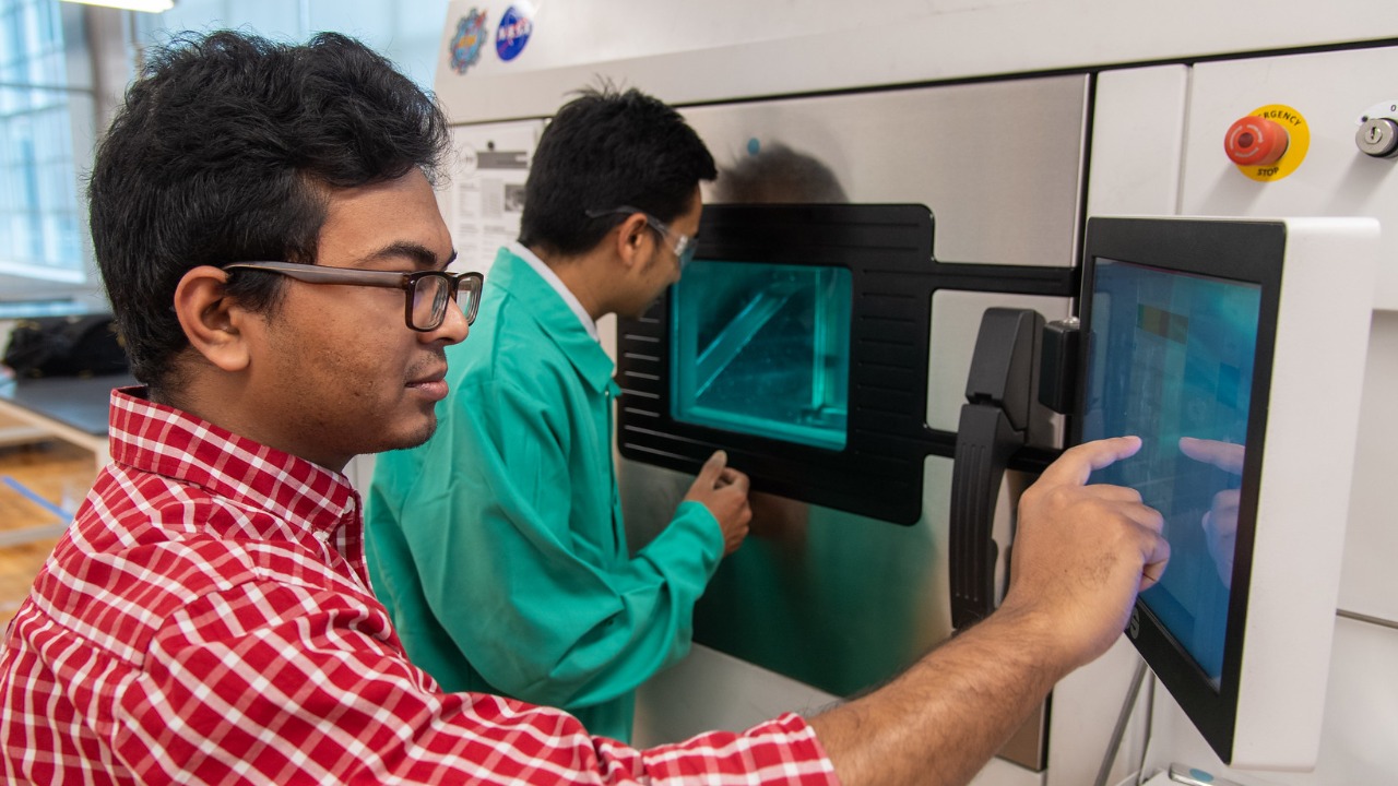 NCAME researchers monitor one of the center's three EOS M290 printers.