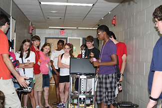 Students learning about Tourbot