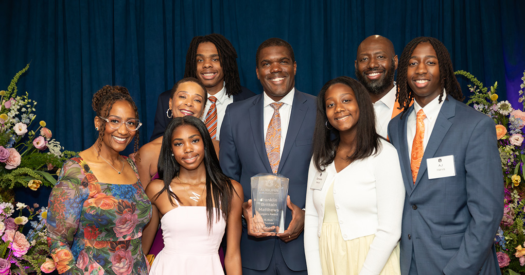 K-Rob Thomas, center, with family and friends.