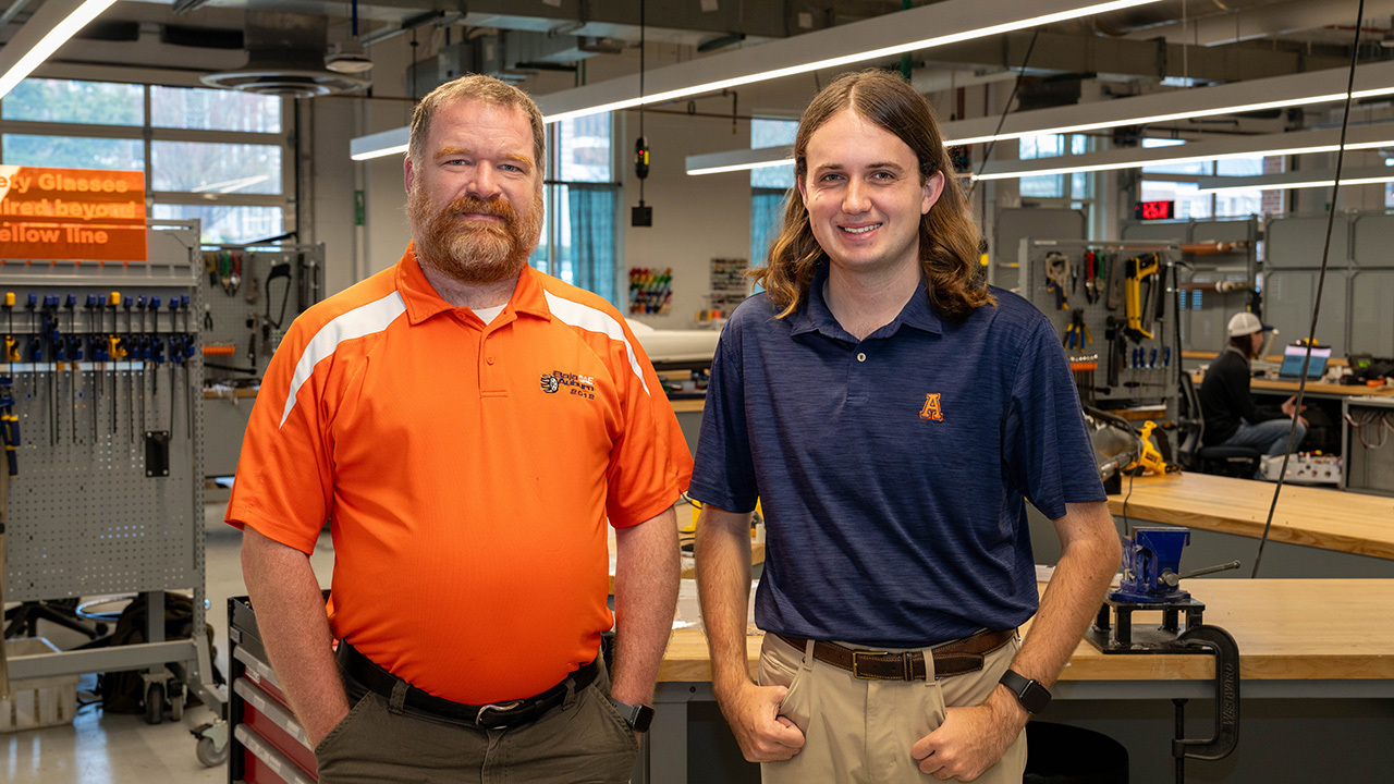Design and Innovation Center manager Garon Griffiths, left, with software engineering sophomore Matthew Clegg.