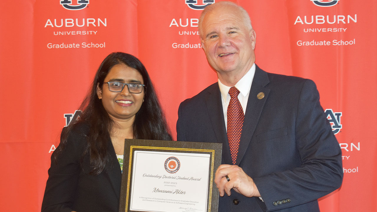 Mousumi Akter, a graduate student in computer science and software engineering, with Graduate School Dean George Flowers, was among the college's 13 students recognized.