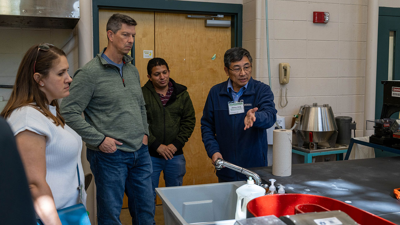 APPF conference guests had the opportunity to tour the Alabama Center for Paper and Bioresource Engineering laboratory, led by Center Director Zhihua Jiang, right.