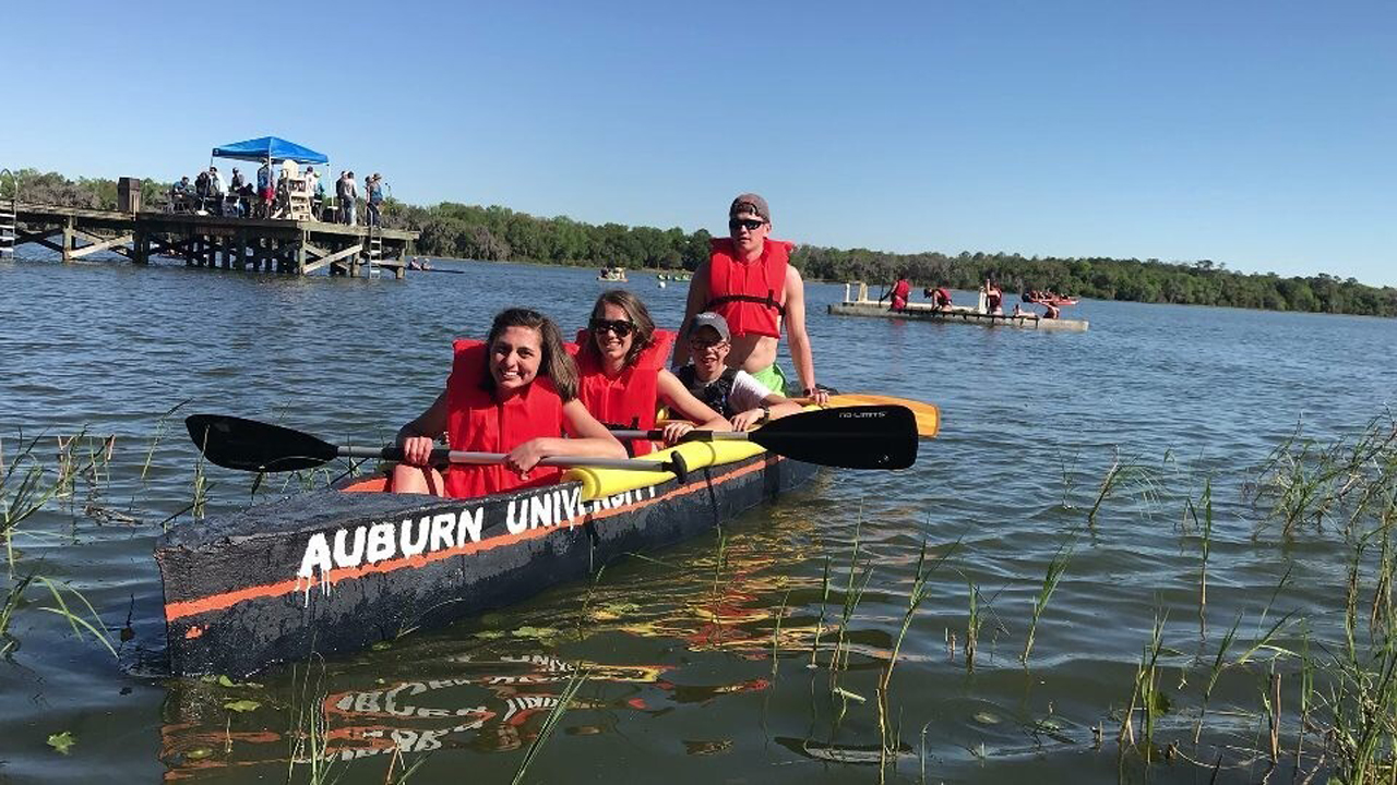 Students from the Auburn University chapter of the American Society of Civil Engineers participate in a concrete canoe race at the University of Florida in 2018.