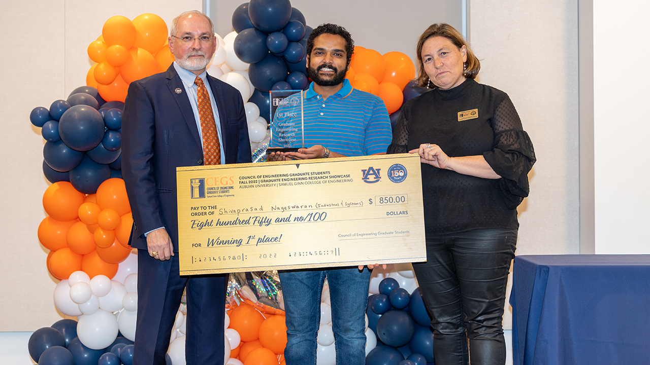 Graduate Engineering Research Showcase overall winner Shiva Nageswaran with, from left, Steve Taylor, interim dean, and Maria Auad, CEGS advisor and associate dean for graduate studies and faculty development.