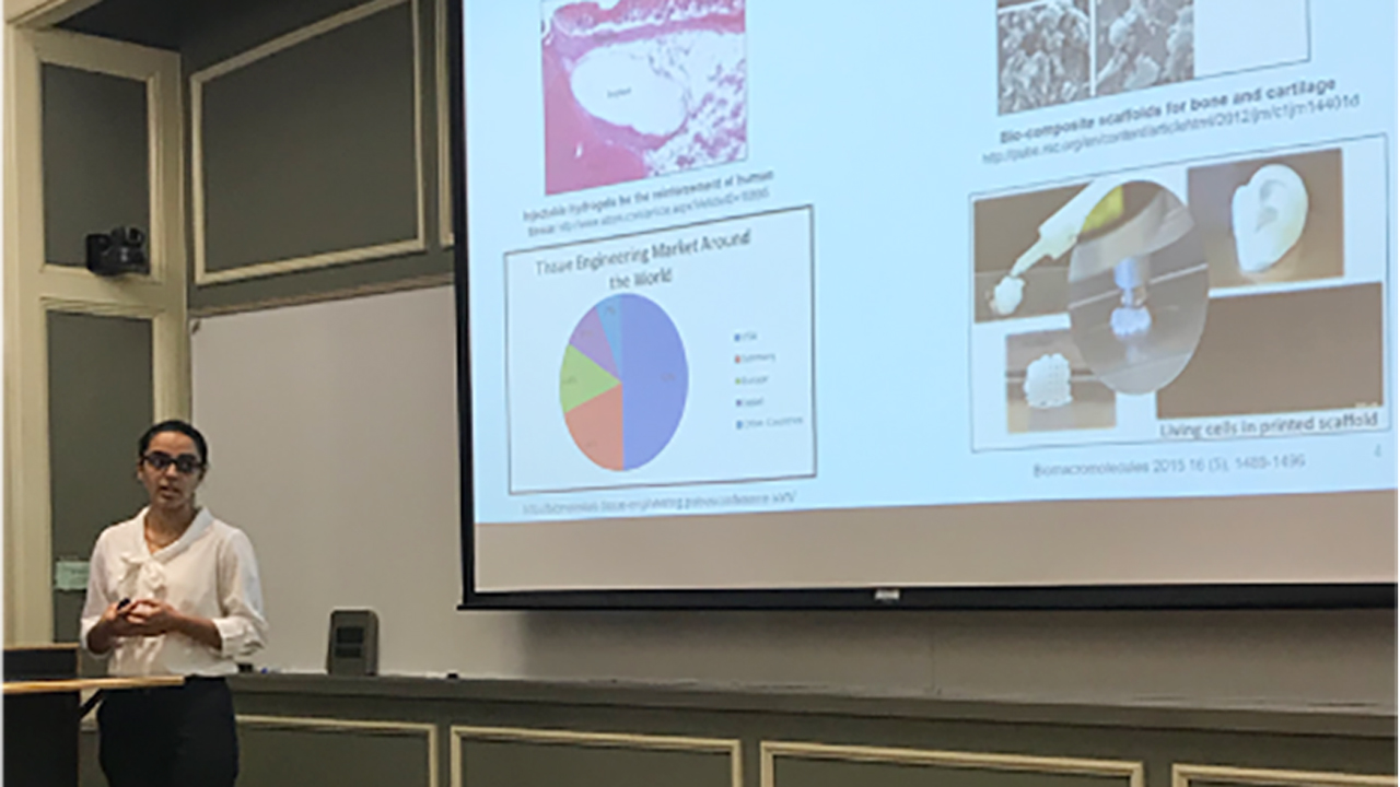A graduate student presents her research at the annual Graduate Summer Seminar Series.