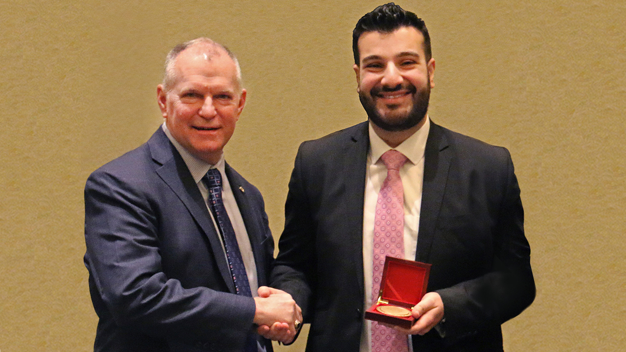 Rudy Al Ahmar, right, is presented the 2022 Abe M. Zarem Award for Distinguished Achievement in Aeronautics by J.D. McFarlan, vice president and chief engineer at Lockheed Martin.