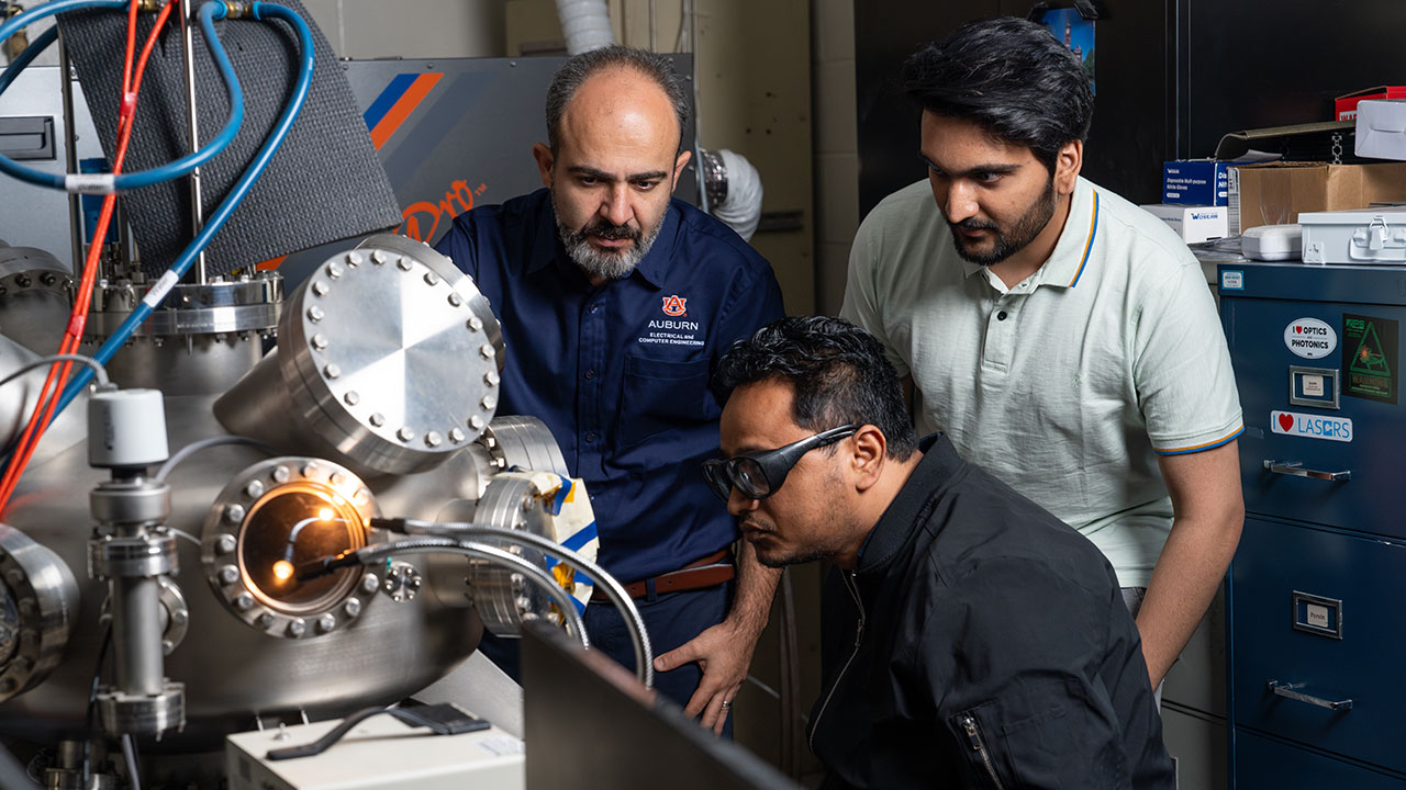 Masoud Mahjouri-Samani with graduate students Suman Jaiswal (seated) and Aarsh Patel in the LASE-END laboratory at Broun Hall.