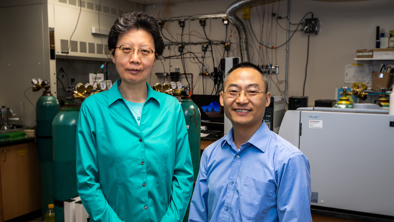 Chemical engineering professors Jin Wang, left, and Peter He.