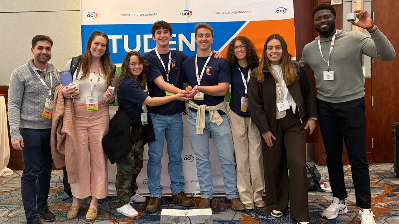 A group of Auburn Engineering students from the ACI chapter pose together at the ACI Concrete Convention after earning a second-place finish in the Egg Protection Device Competition.