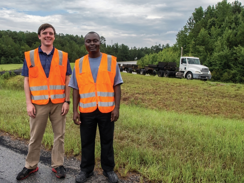 Graduate Students Nathan Moore (left) and Kenneth Tutu (right) at the NCAT Test Track.