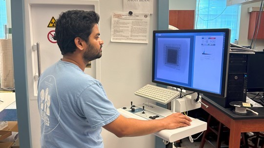 Student working with x-ray machine