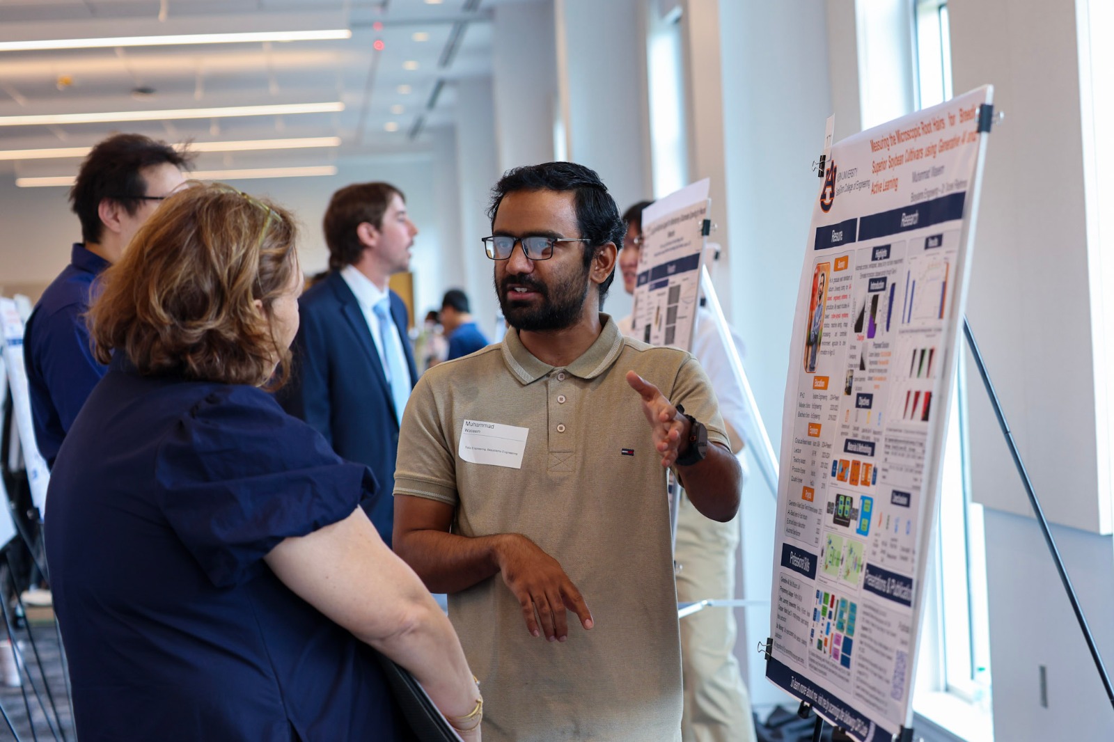 Graduate student presenting a poster