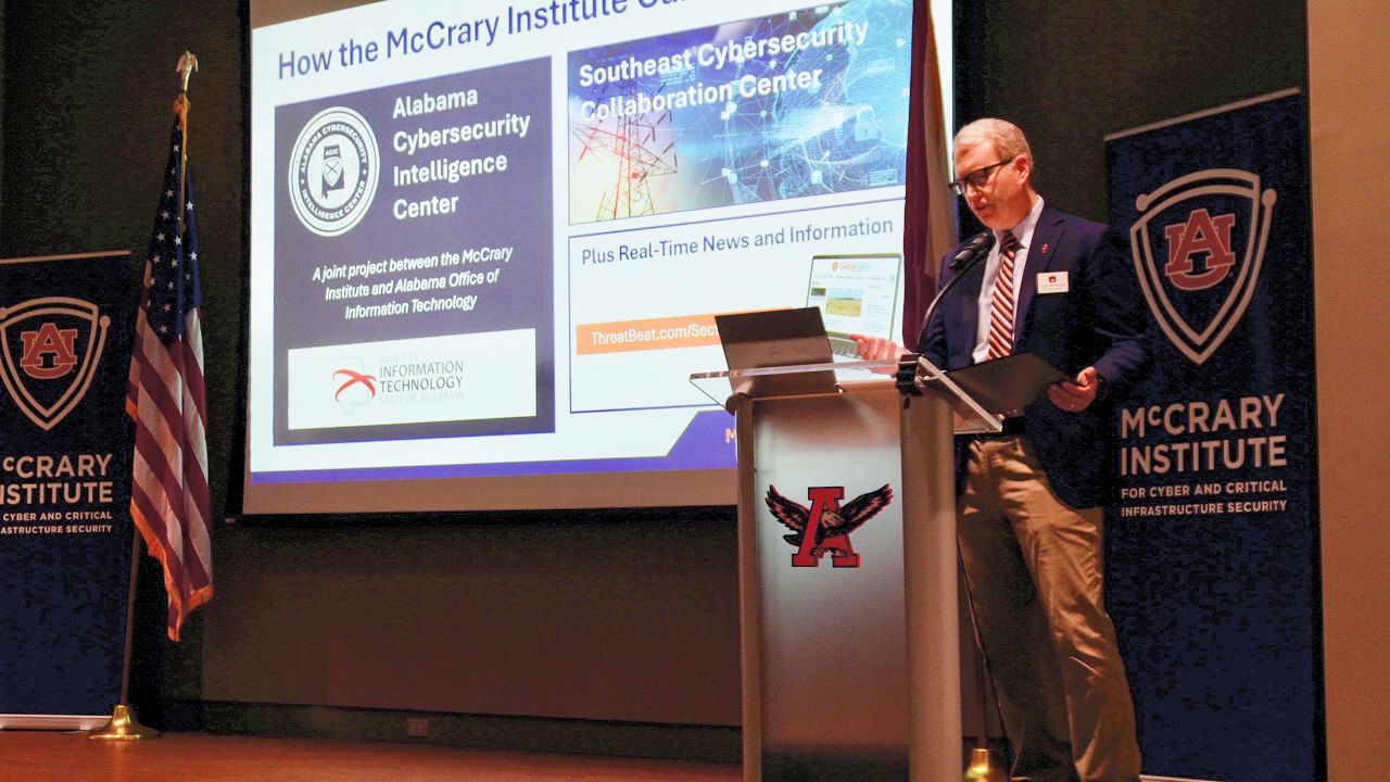 Speaker on stage at Water OT/IT Cyber Summit in Huntsville, Alabama