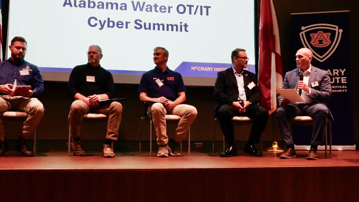 Panel on stage at Water OT/IT Cyber Summit in Huntsville, Alabama