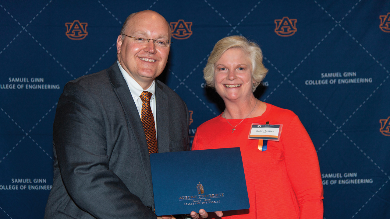 Auburn Engineering Dean Christopher Roberts poses next to Molly Hughes, a lecturer in the Department of Civil and Environmental Engineering.