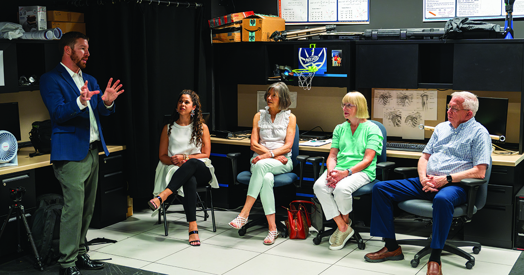 Zabala speaking to people in his lab