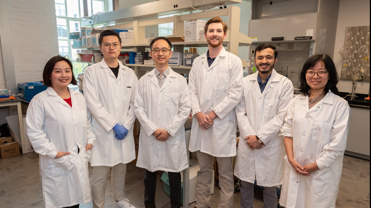 Shiqiang (Nick) Zou, third from left, poses with his research team. From left to right: Zilan Yang, Jiaxiang (Jason) Zhao, Brandon Alderman, Najibullah Zulfeqar and Ao Xie. 
