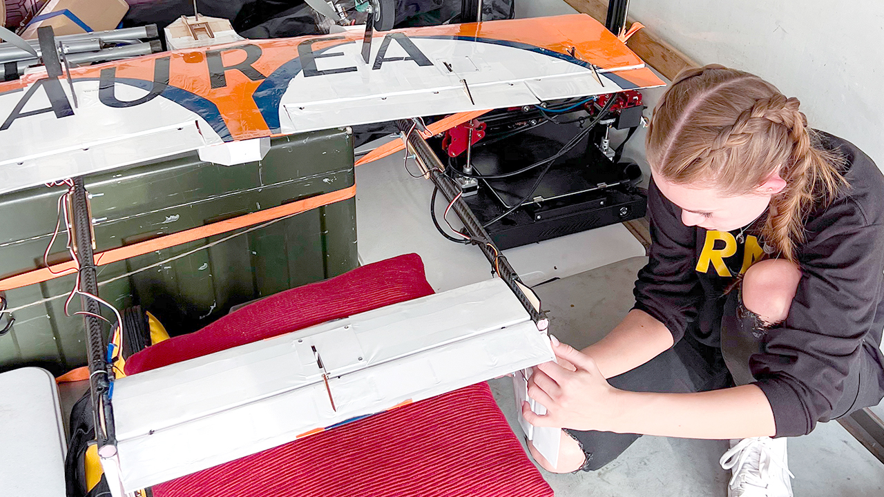 Outgoing president of Auburn University’s Design, Build, Fly team, Meagan Blosser, puts the final touches on her team’s plane before flying its first mission at the AIAA Design, Build, Fly competition in Wichita, Kansas in April.