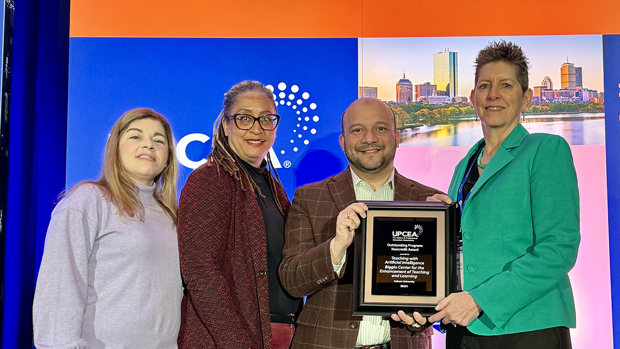 DeElla Wiley, Shawndra Bowers and Asim Ali (pictured left to right) accept the Outstanding Program: Noncredit Award from Kim Siegenthaler, Associate Vice Chancellor for Academic Innovation at City University of New York and Board President of UPCEA.