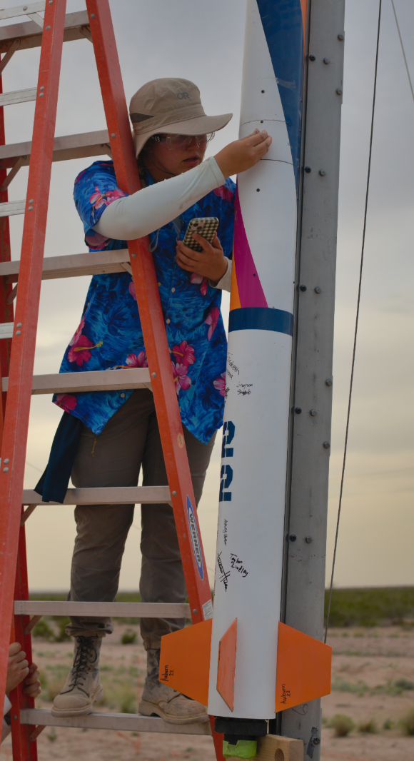 Elisabeth Bonnema works on the AURA rocket before launch.