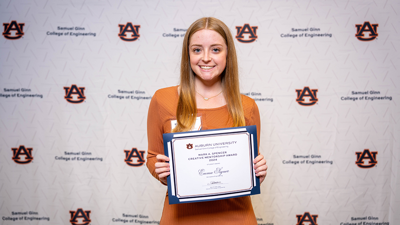 Emma Signor, an aerospace engineering graduate, holds the Mark Spencer Creative Mentorship Award earned at the Samuel Ginn College of Engineering annual spring awards ceremony in April 2024. Signor plans to return to Auburn in the fall of 2024 to obtain a master's degree in aerospace engineering.   