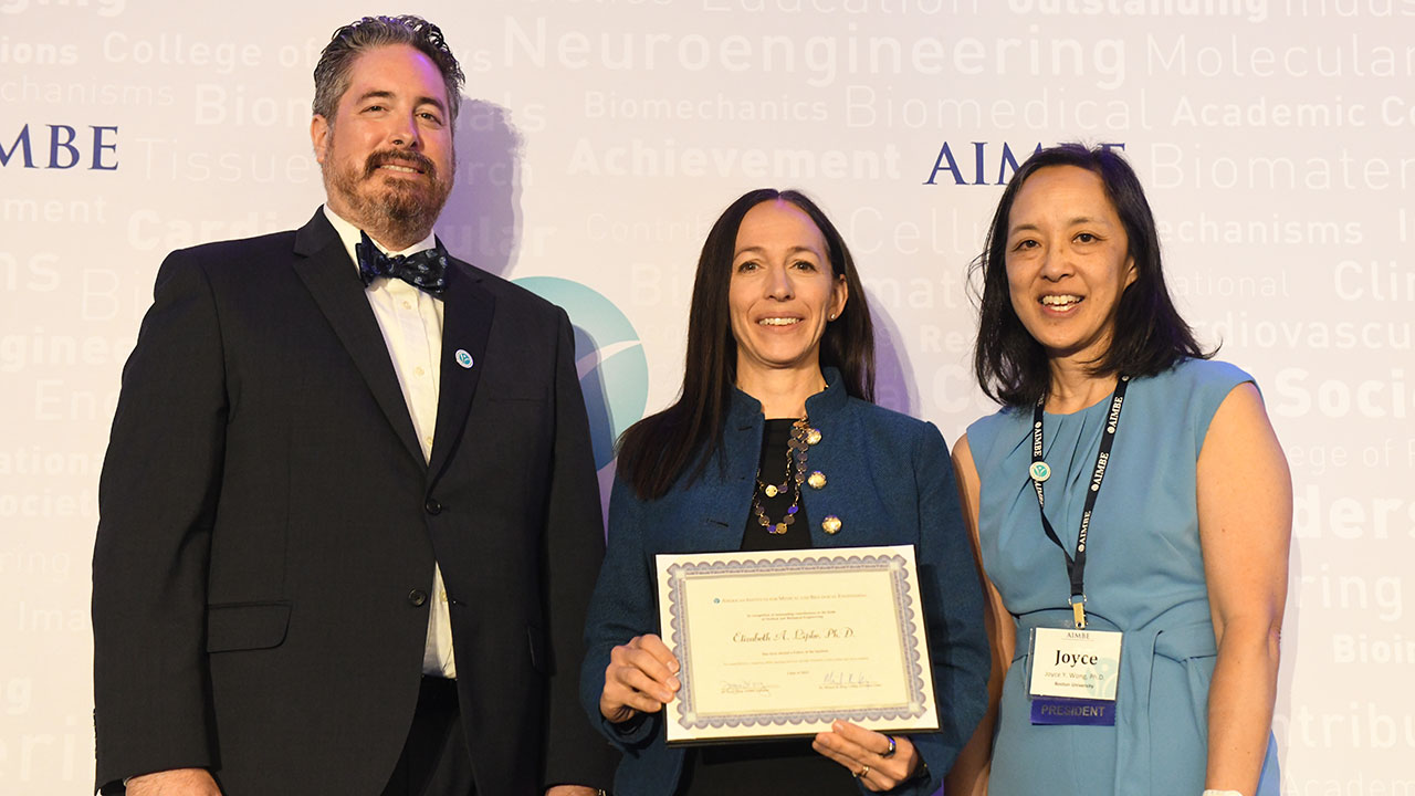 Elizabeth Lipke, the George E. and Dorothy Stafford Uthlaut Endowed Professor of Chemical Engineering (center), with Mike King (left), Chair of the AIMBE College of Fellows, and Joyce Wong, AIMBE President.