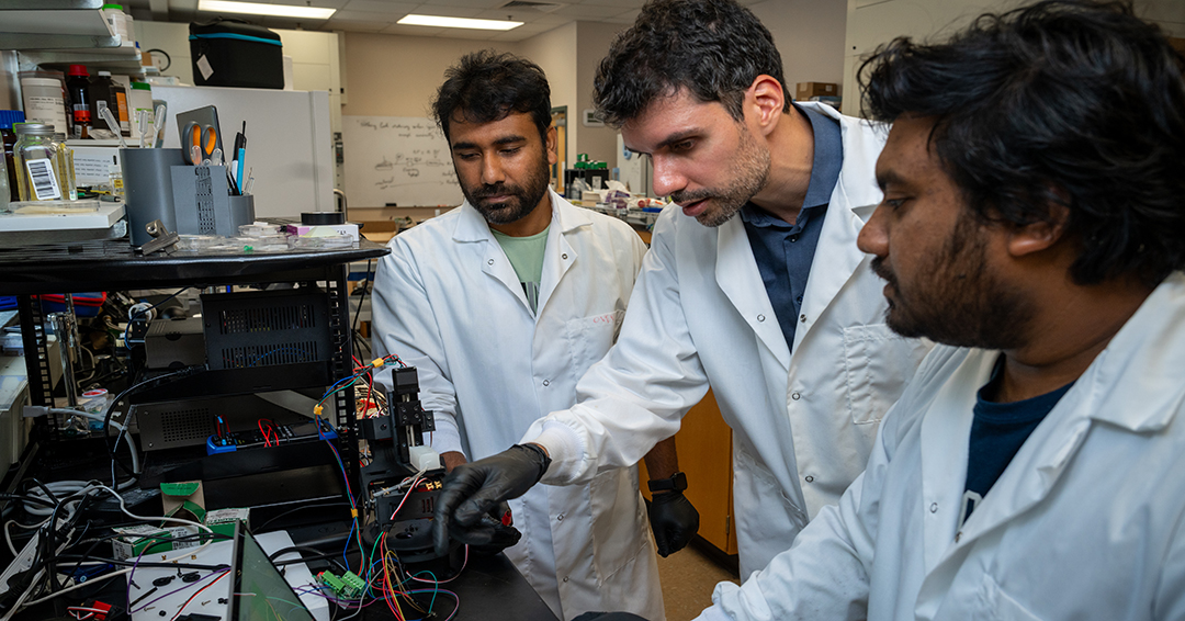 Assistant Professor of Chemical Engineering Jean-Francois Louf, center, is exploring how engineered devices can communicate with living nerve cells.