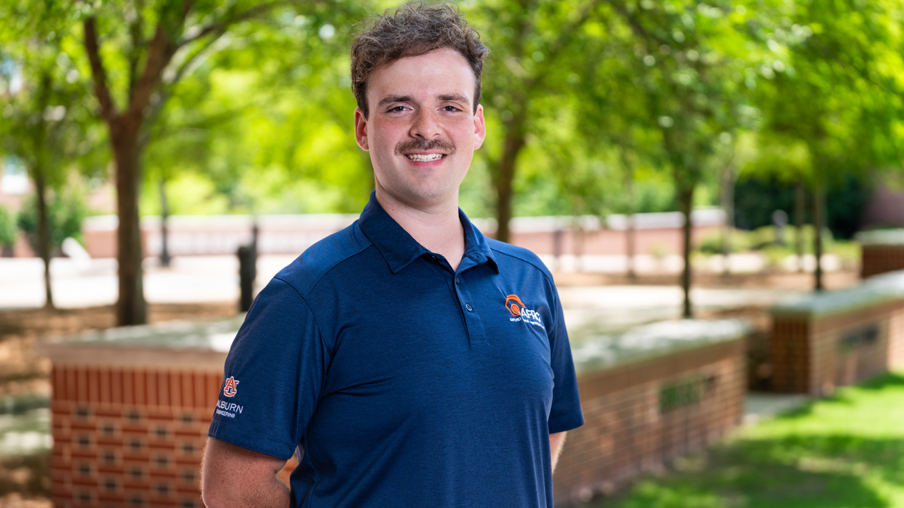 Matthew Hooks, a master's student in the Department of Aerospace Engineering poses for a photo outside of Shelby Hall on Auburn's campus. 