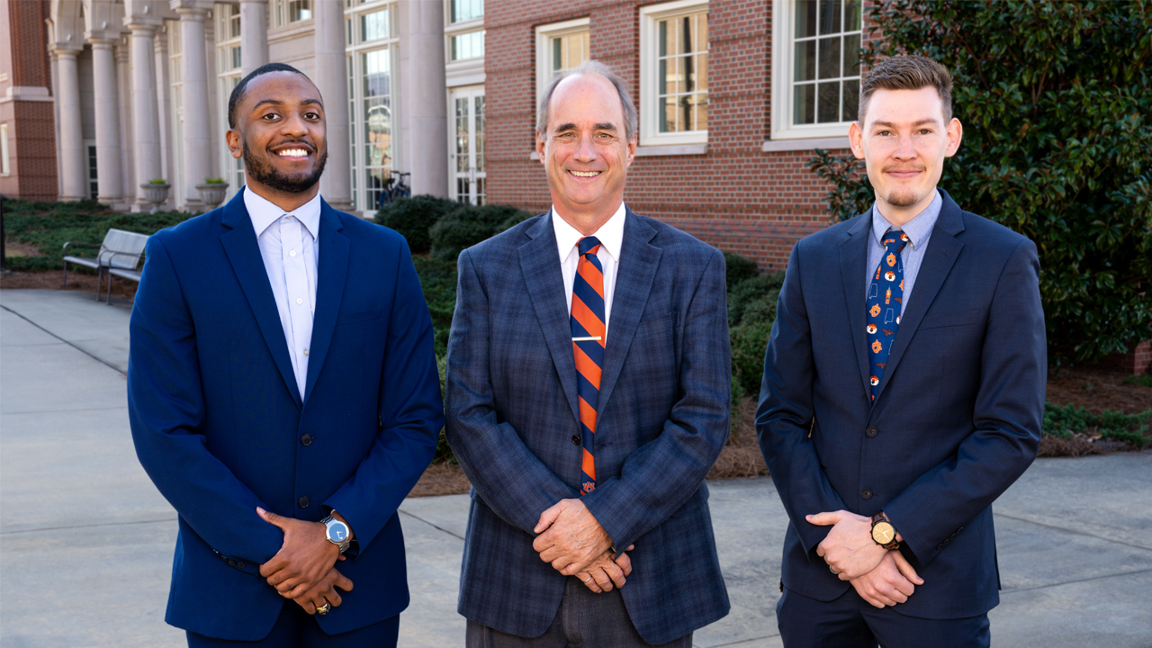 Larry Rilett, AUTRI director (middle), Adrian Cottam, AUTRI assistant research professor (right) and Corey McDaniels, doctoral student in the Department of Computer Science and Software Engineering (left) pose for a photo on Auburn’s campus. The three are collaborating with the University of Nebraska-Lincoln Midwest Roadside Safety Facility and the Department of Defense to improve safety. 