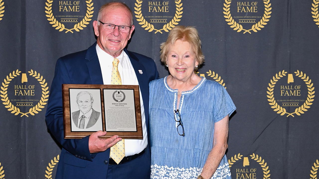 Steve Newton poses for a picture with his wife, Dorothy Newton, at the  Alabama Sports Officials Foundation Hall of Fame ceremony. 