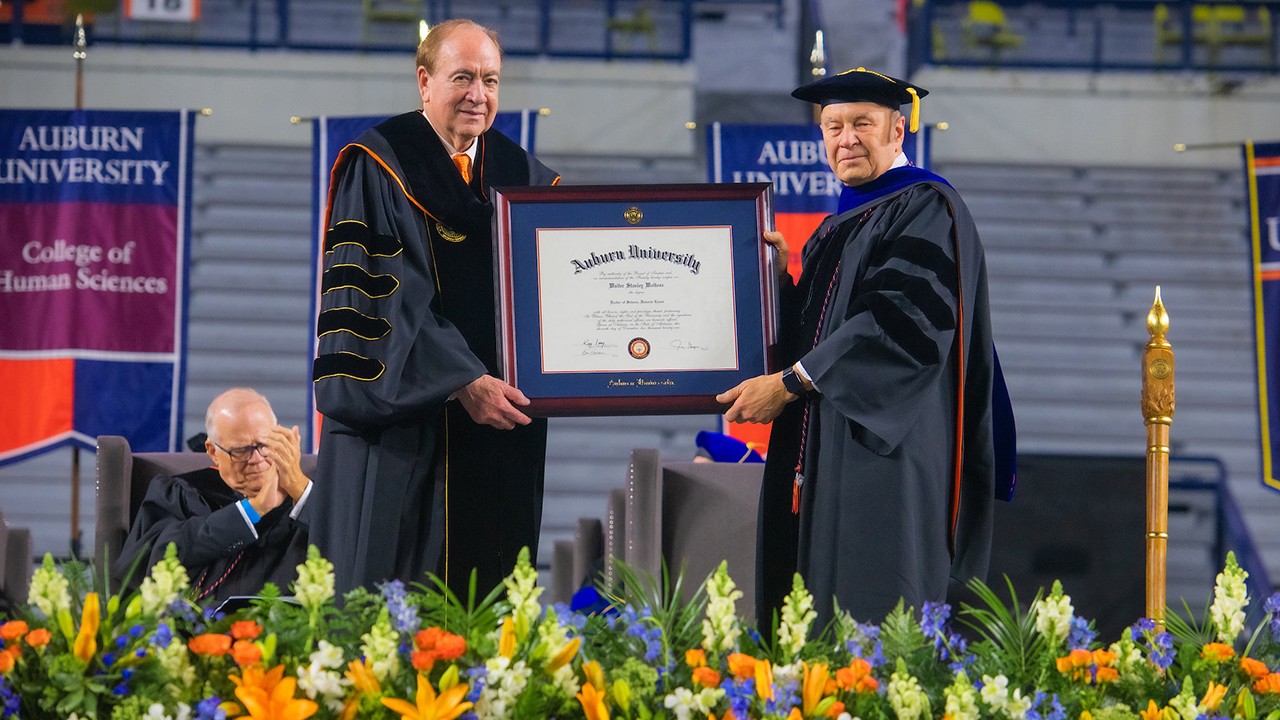 President Jay Gogue presents Walt Woltosz with an Honorary Doctorate of Science.