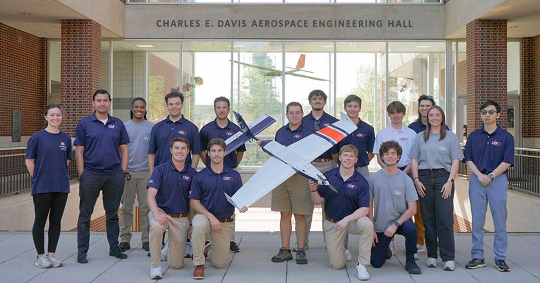 Members of Auburn Engineering’s Design Build Fly team pose with their competition aircraft outside of Davis Hall after finishing ninth overall internationally and first among Southeastern Conference schools at the 2026 AIAA Design Build Fly competition in Wichita, Kansas.