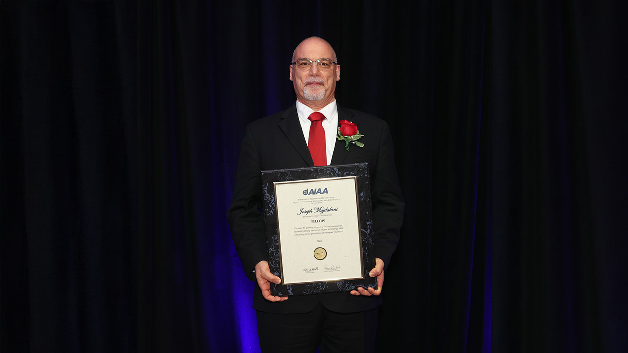 Joe Majdalani, the Hugh and Loeda Francis Chair of Excellence in the Department of Aerospace Engineering, receives a commemorative plaque as part of his induction as an AIAA Fellow on May 14 in Washington D.C. 