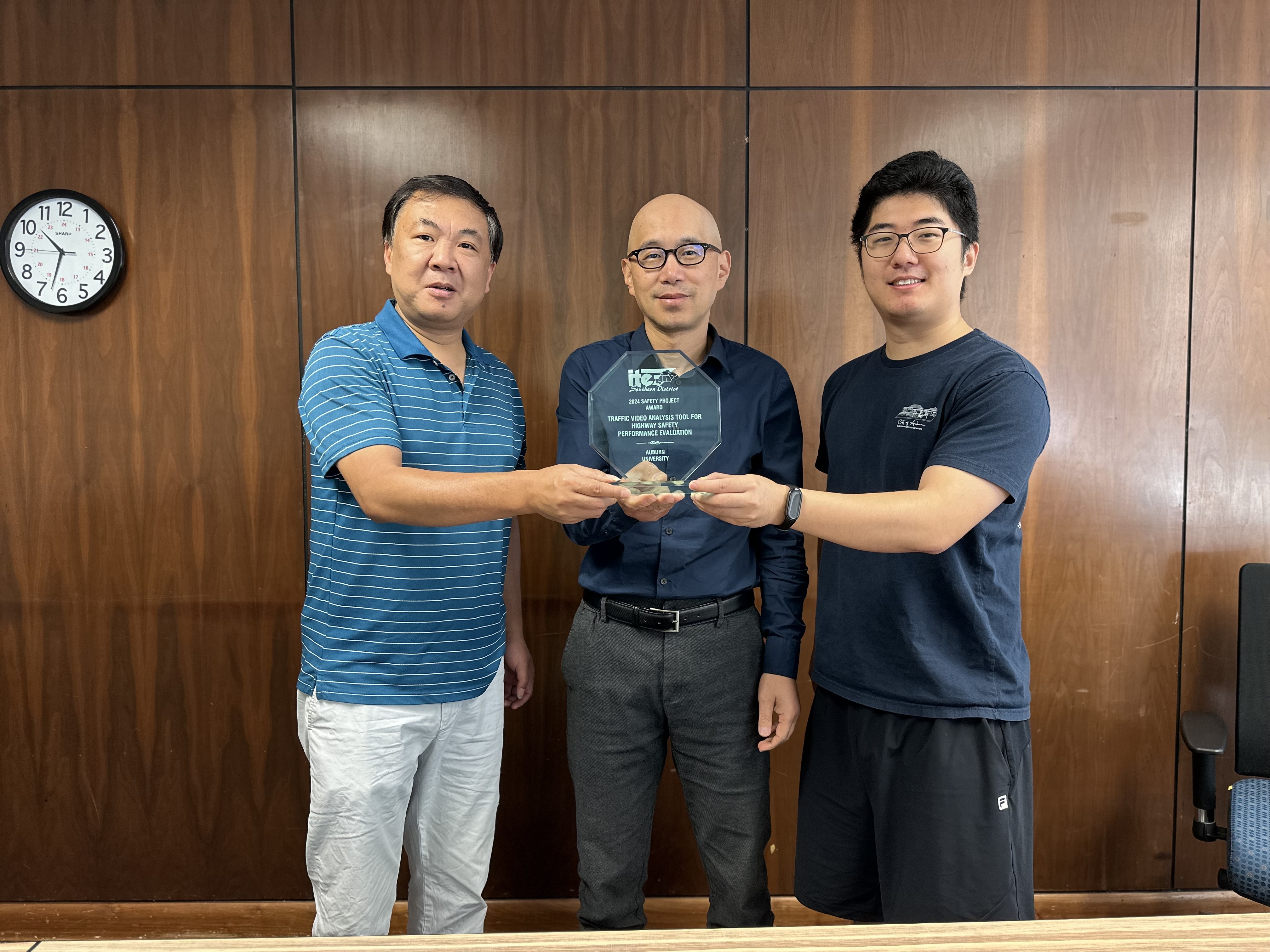 Yang Zhou,  Huaguo Zhou and Alex Zhao present their Special Project Award on Traffic Safety at the Southern District Institute of Transportation Engineers.
