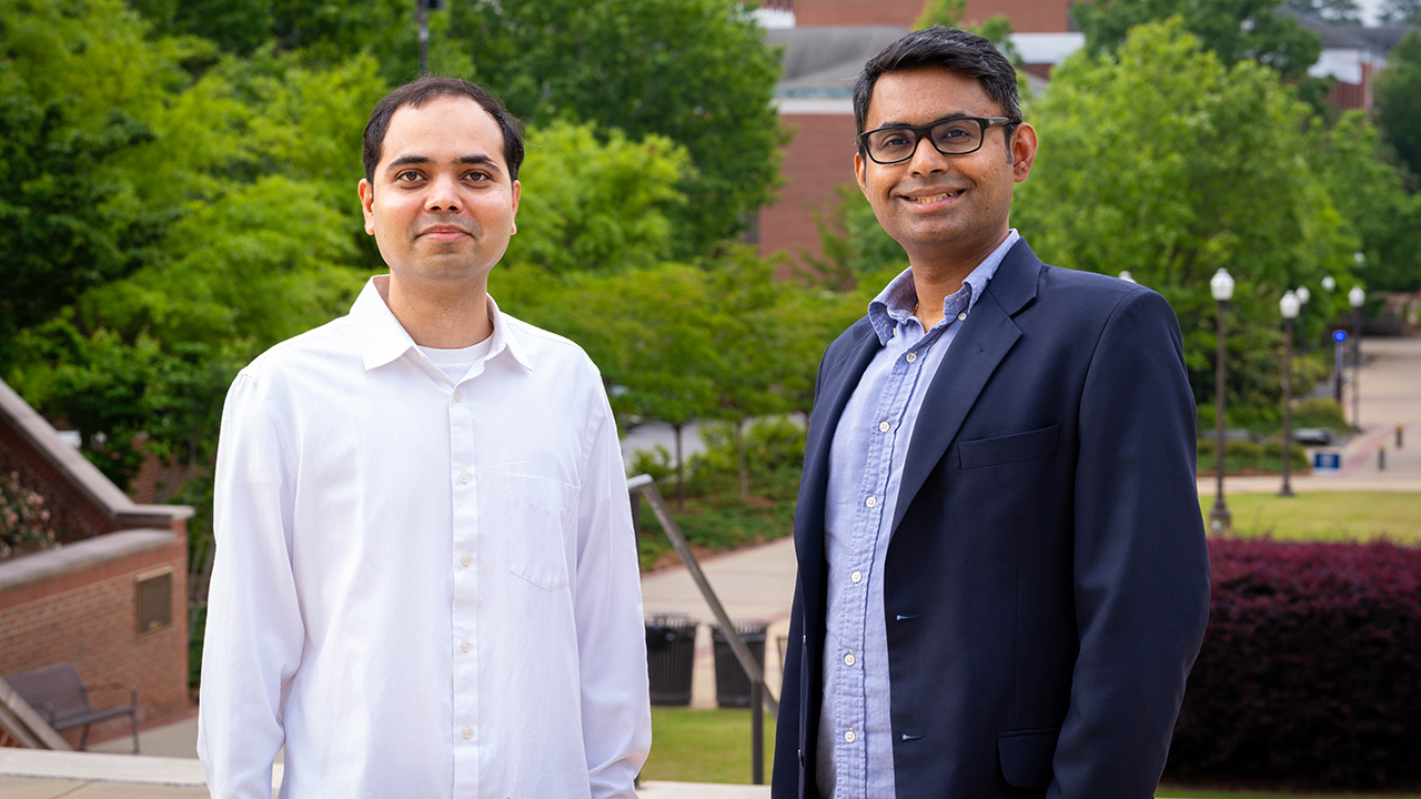 Nek Sharan (left) and Vrishank Raghav (right), both aerospace engineering faculty, pose for a photo outside on Auburn University’s campus. 