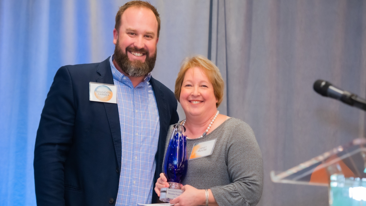 Branden Farmer, student services coordinator for the Auburn University Department of Industrial and Systems Engineering, was recently recognized with the Outstanding New Advisor award. He is pictured with Janet Moore, assistant dean and director of student services in the Samuel Ginn College of Engineering, who nominated Farmer for the award. 